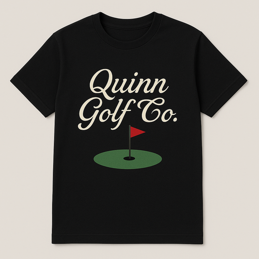 Black t-shirt with 'Quinn Golf Co.' text and golf flag design on a beige background